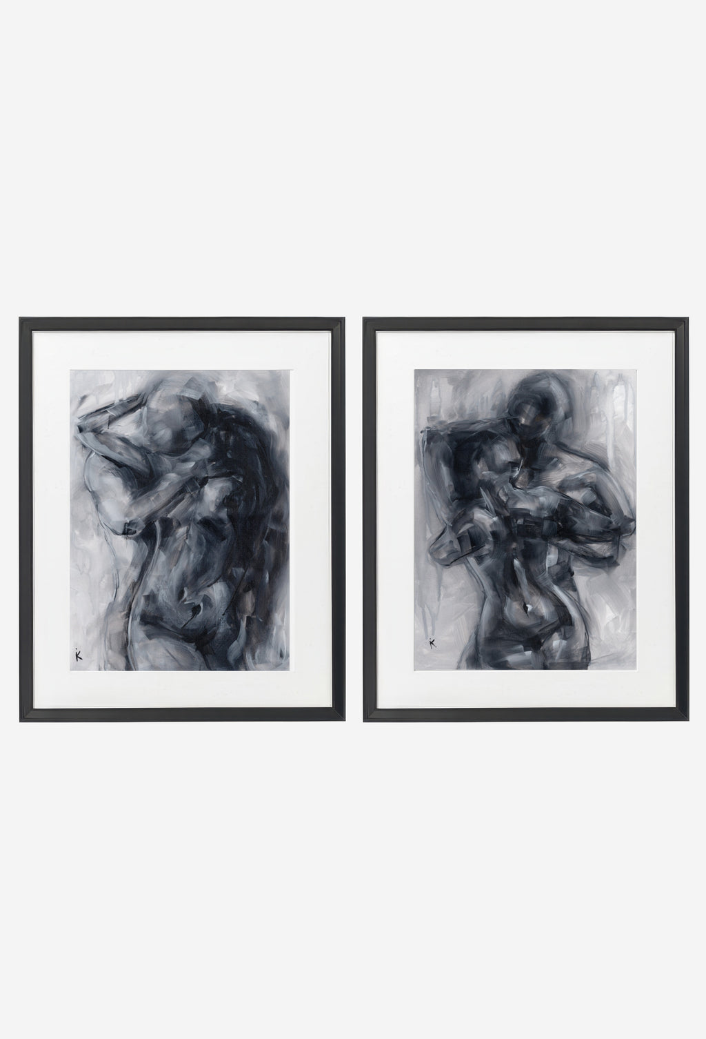 Two monochrome figure prints in thin black frames on a wall