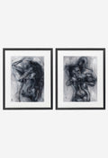 Two monochrome figure prints in thin black frames on a wall