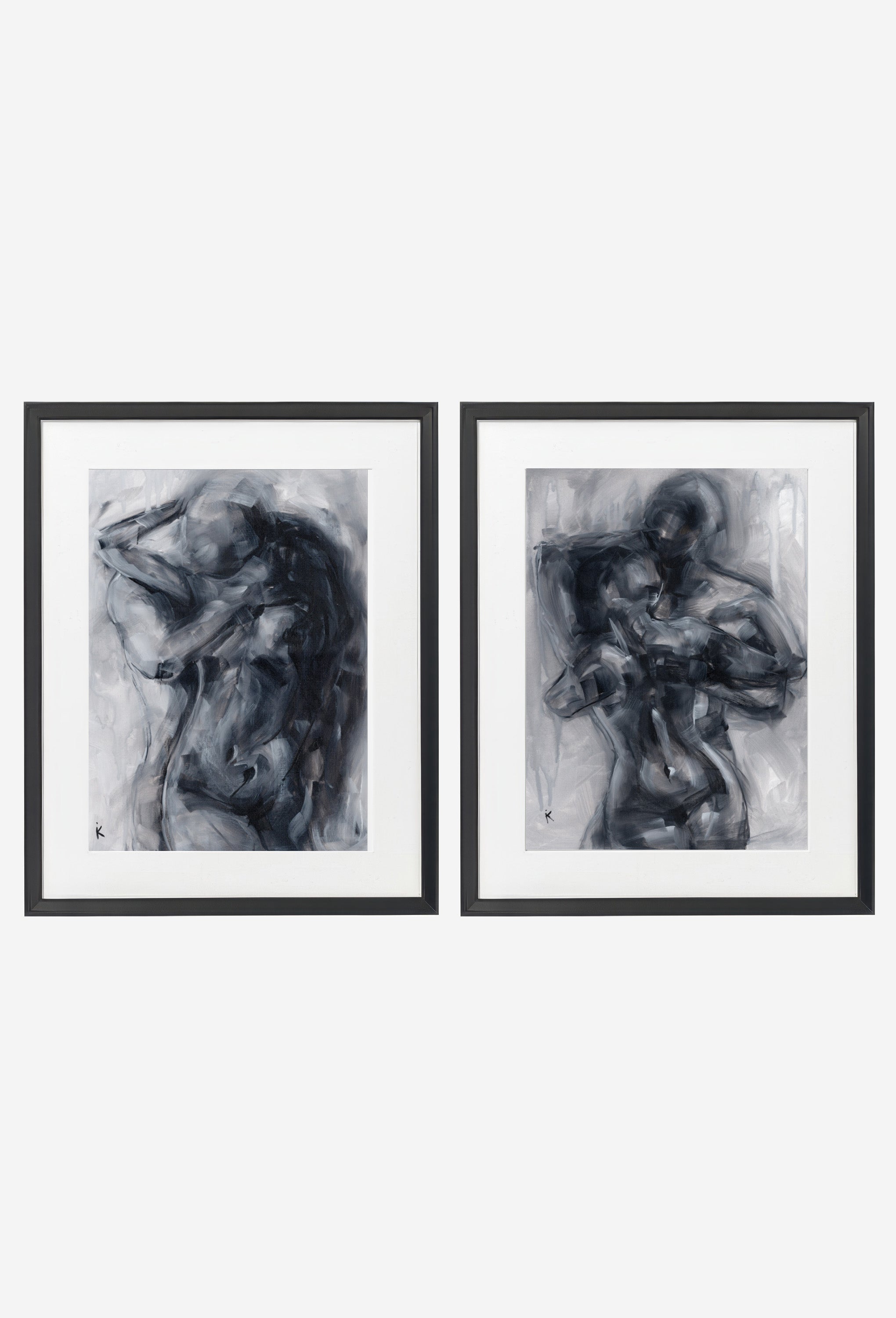 Two monochrome figure prints in thin black frames on a wall